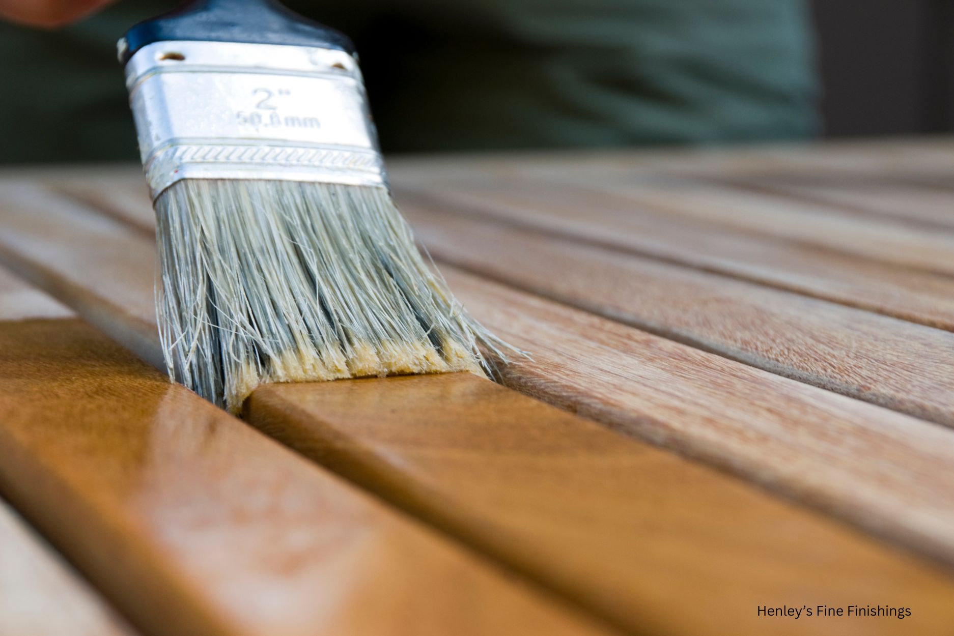 Freshly stained wood fence and deck by Henley's Fine Finishings in St. Augustine